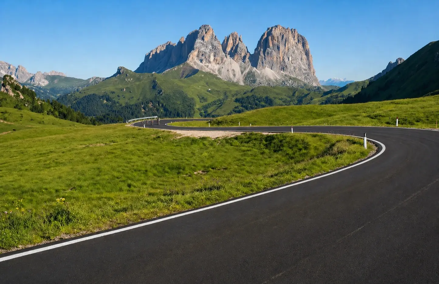 Towering Dolomites peaks above an alpine road