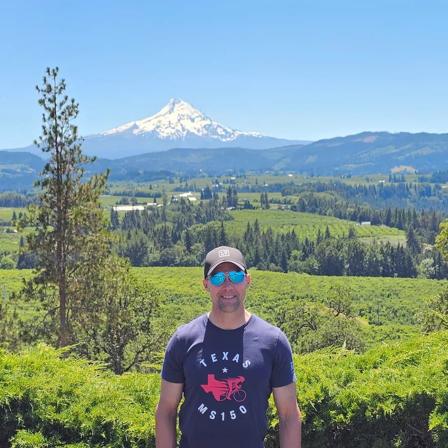 Carey Rouse, founder of Velo Escapes, with Mount Hood behind him