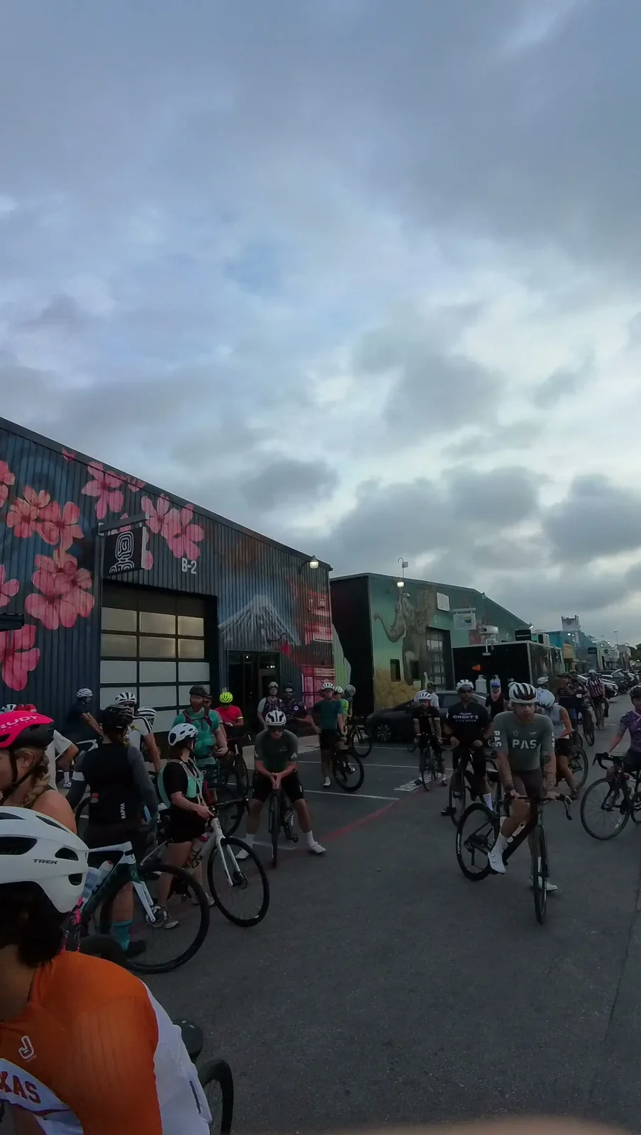 The group gathering outside the bike shop before an evening ride