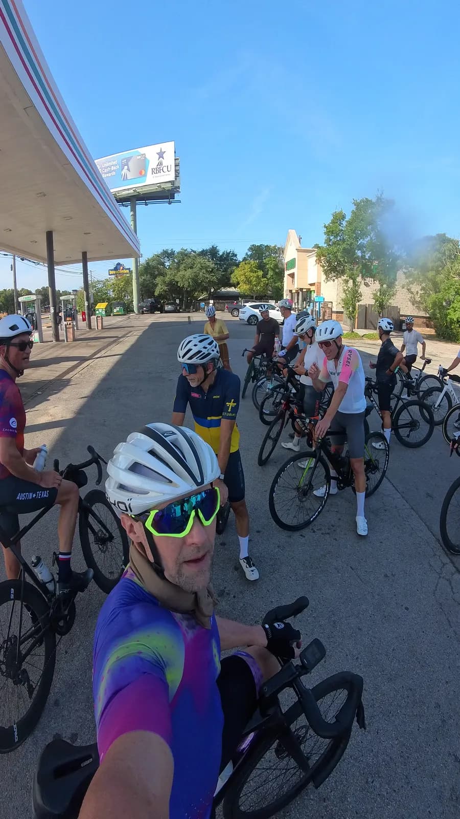 The group regrouping at a gas station stop, mid-ride
